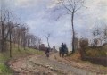 Carro en una carretera rural en las afueras de Louveciennes 1872 Camille Pissarro paisaje